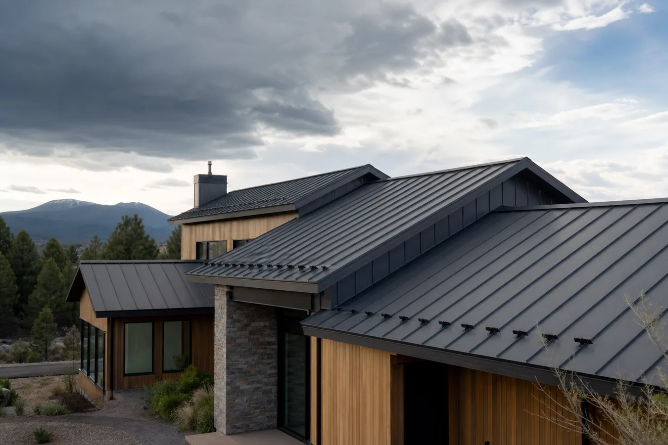 Illustrated standing-seam metal roof on an Oregon home.